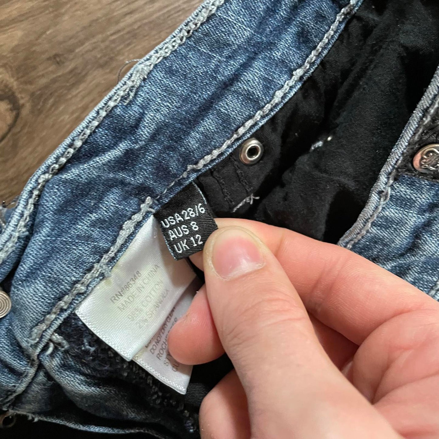 True Lux Flared Jeans Cross Detail